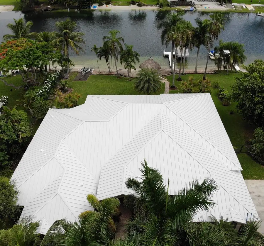 Completed Aluminum White standing-seam metal roof replacement by Proper Roofing in Miami, January 2025