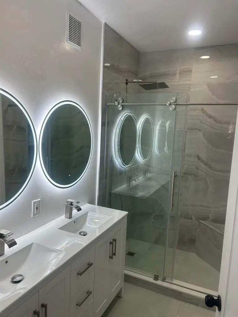 Onyx-look shower with bench — Bathroom remodel by Proper Roofing
