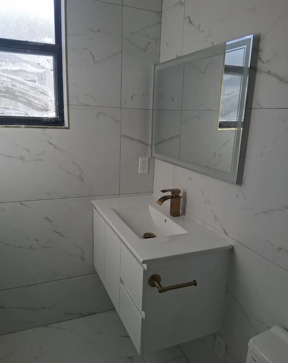 Guest and powder bathrooms — Bathroom remodel by Proper Roofing