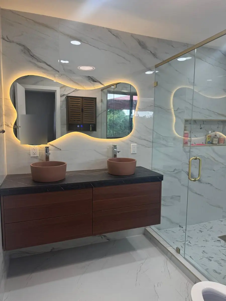 Walnut vanity, terracotta sinks — Bathroom remodel by Proper Roofing
