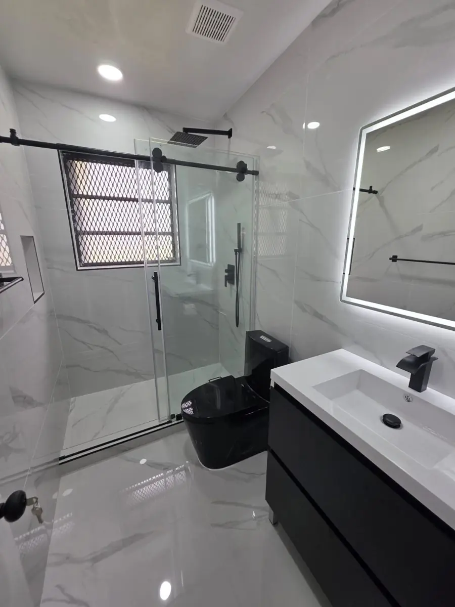 Guest and powder bathrooms — Bathroom remodel by Proper Roofing