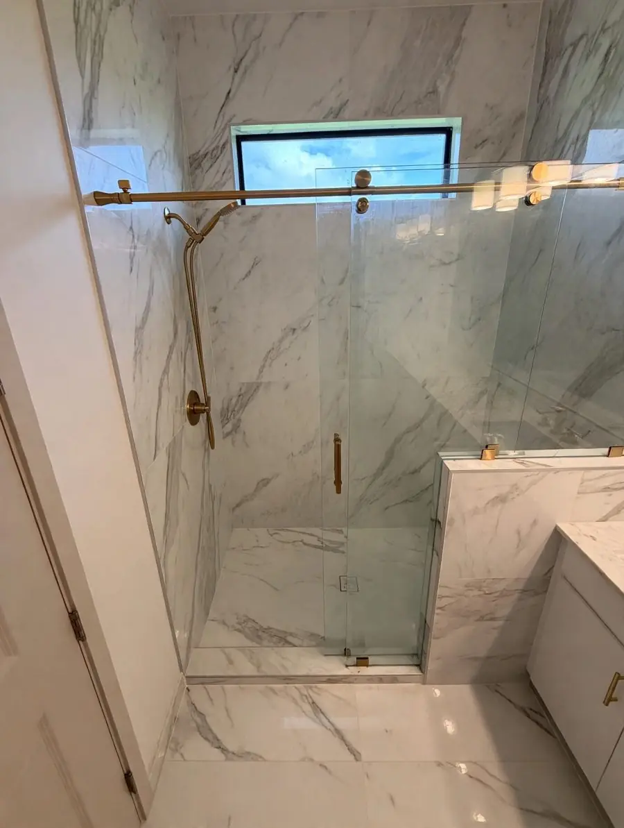 Vanity and shower, brushed gold — Bathroom remodel by Proper Roofing