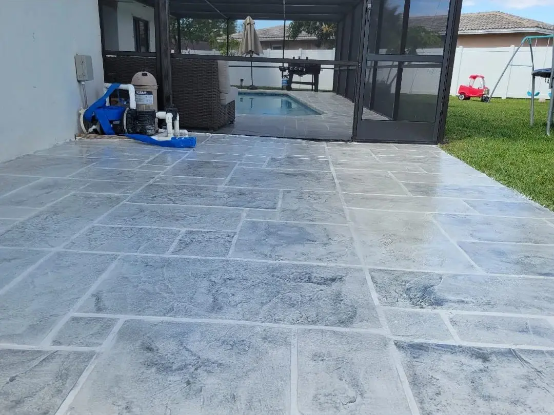 Stamped concrete pool decks and patios — Pool deck by Proper Roofing
