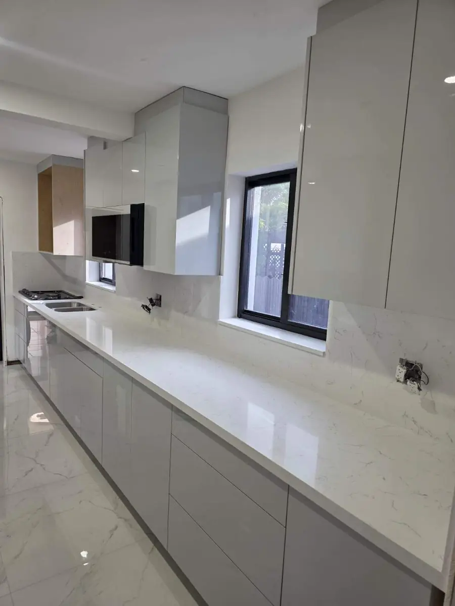 Grey high-gloss galley kitchen — Kitchen remodel by Proper Roofing