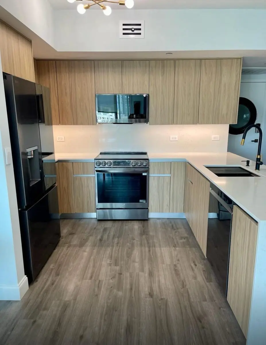 Light-oak flat-panel kitchen — Kitchen remodel by Proper Roofing