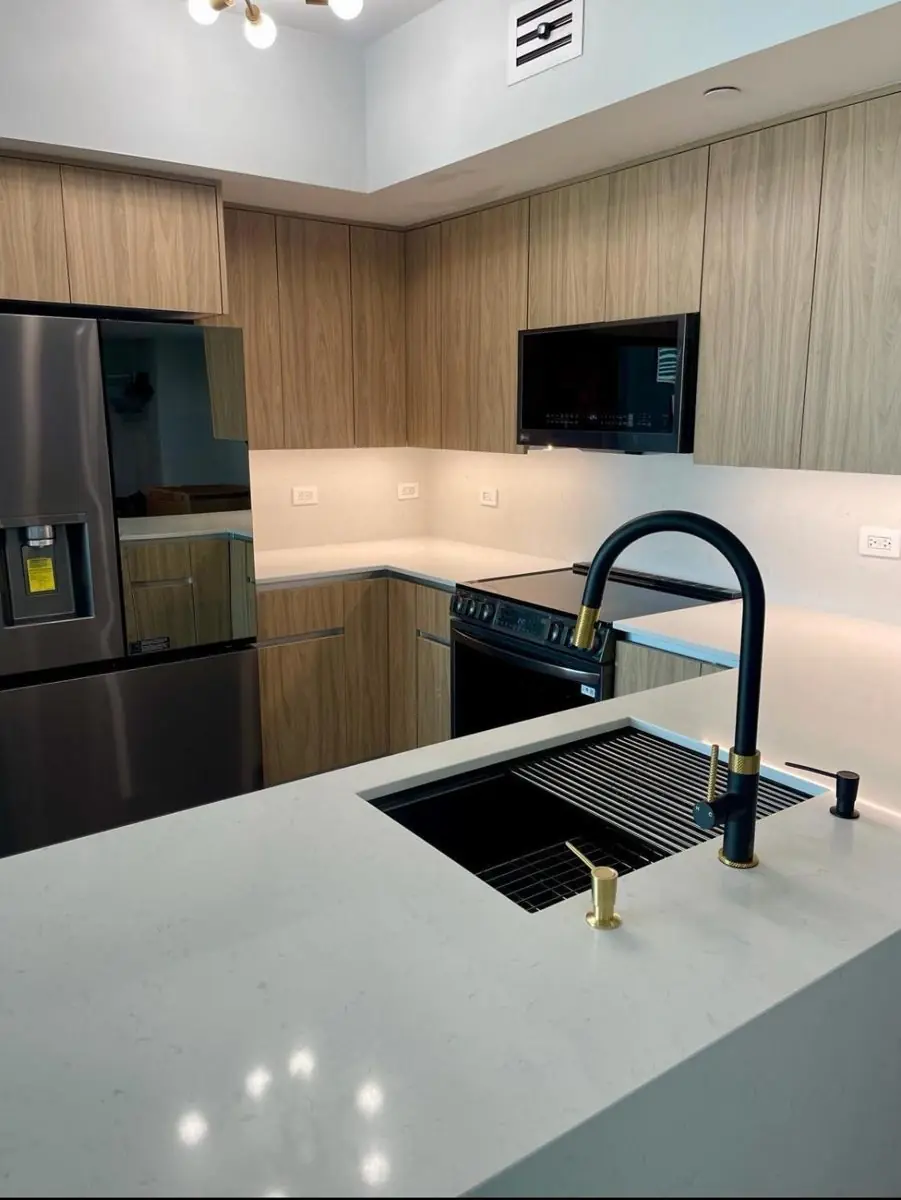 Light-oak flat-panel kitchen — Kitchen remodel by Proper Roofing
