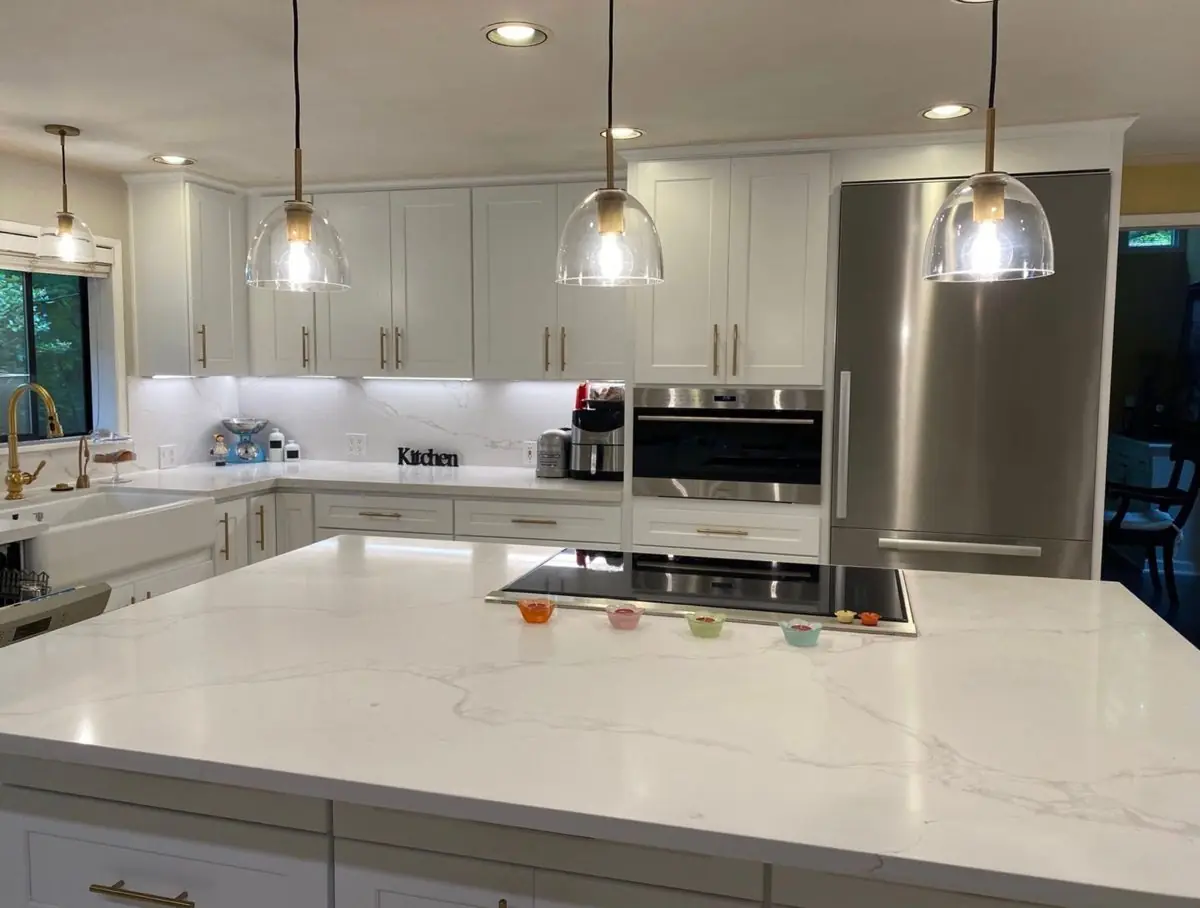 White shaker kitchen with island — Kitchen remodel by Proper Roofing