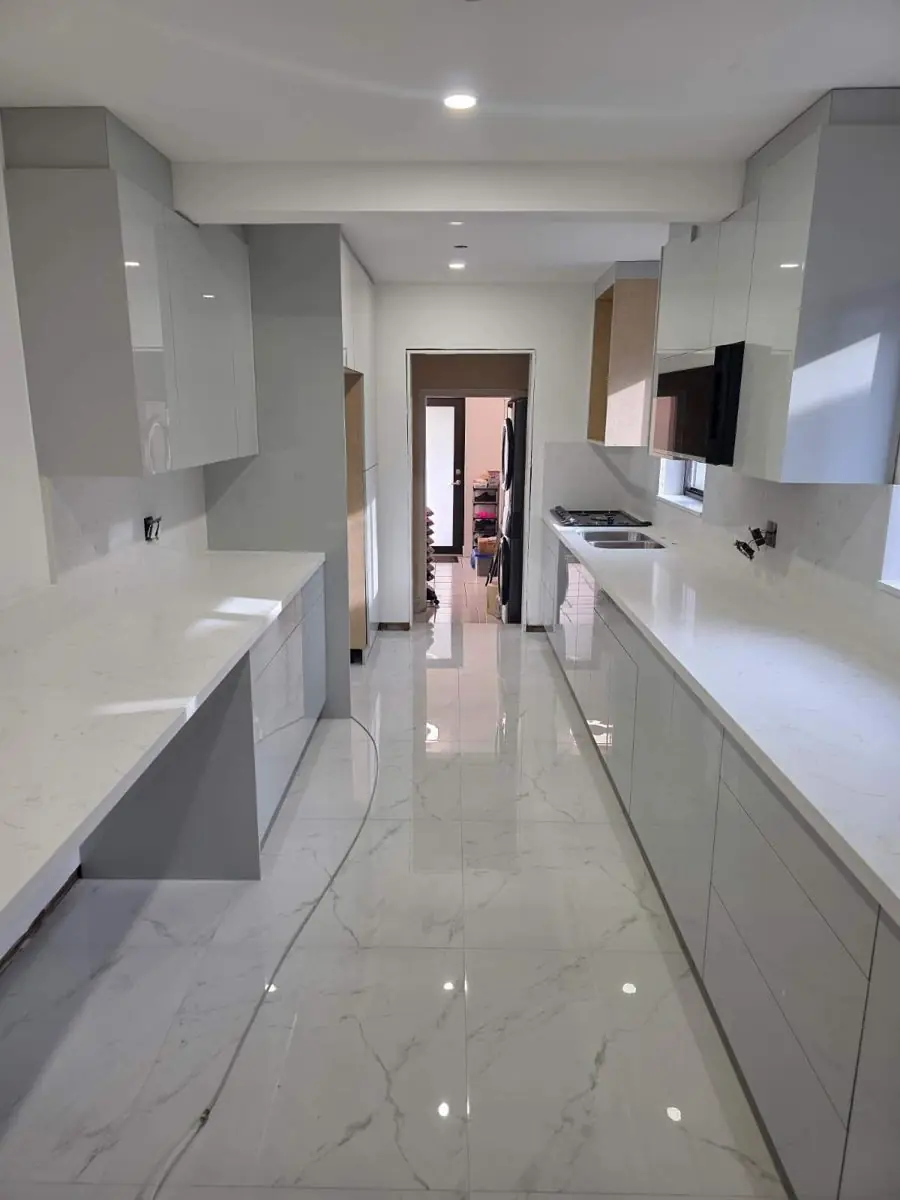 Grey high-gloss galley kitchen — Kitchen remodel by Proper Roofing