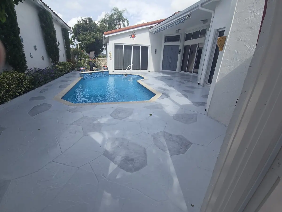 Stamped concrete pool decks and patios — Pool deck by Proper Roofing