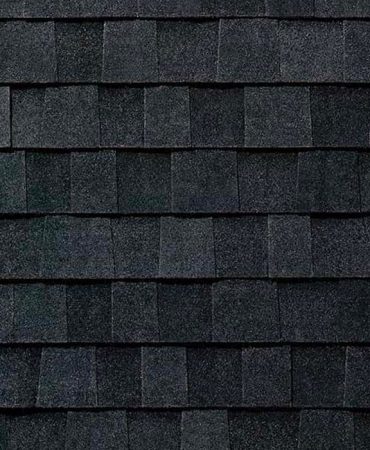 black asphalt roof shingles arranged in a pattern